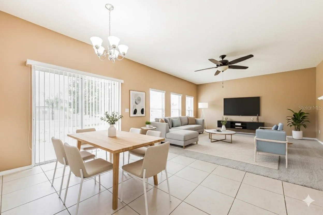 Dining and living area at the Cheval Street home in Mount Dora, Florida, staged with a dining table and living room seating