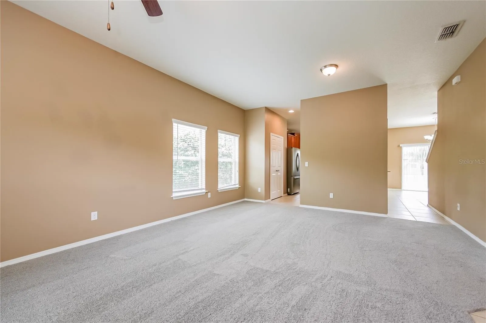 Family room at the Cheval Street home in Mount Dora, Florida, with a view through to the kitchen and dining area