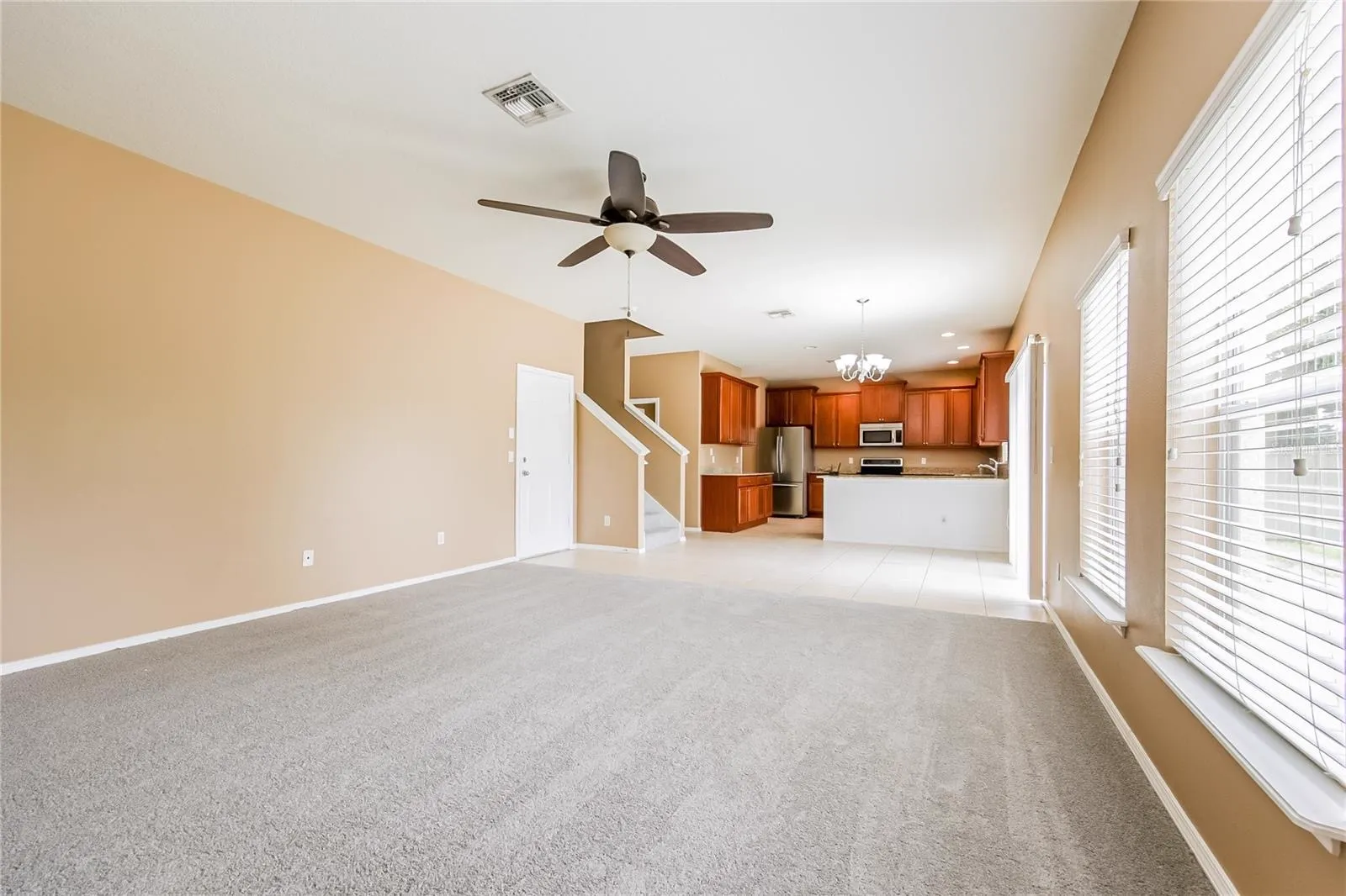 Family room at the Cheval Street home in Mount Dora, Florida, opening directly into the kitchen