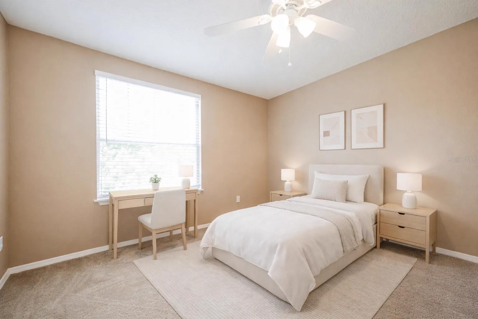 Secondary bedroom at the Cheval Street home in Mount Dora, Florida, staged with a bed and desk