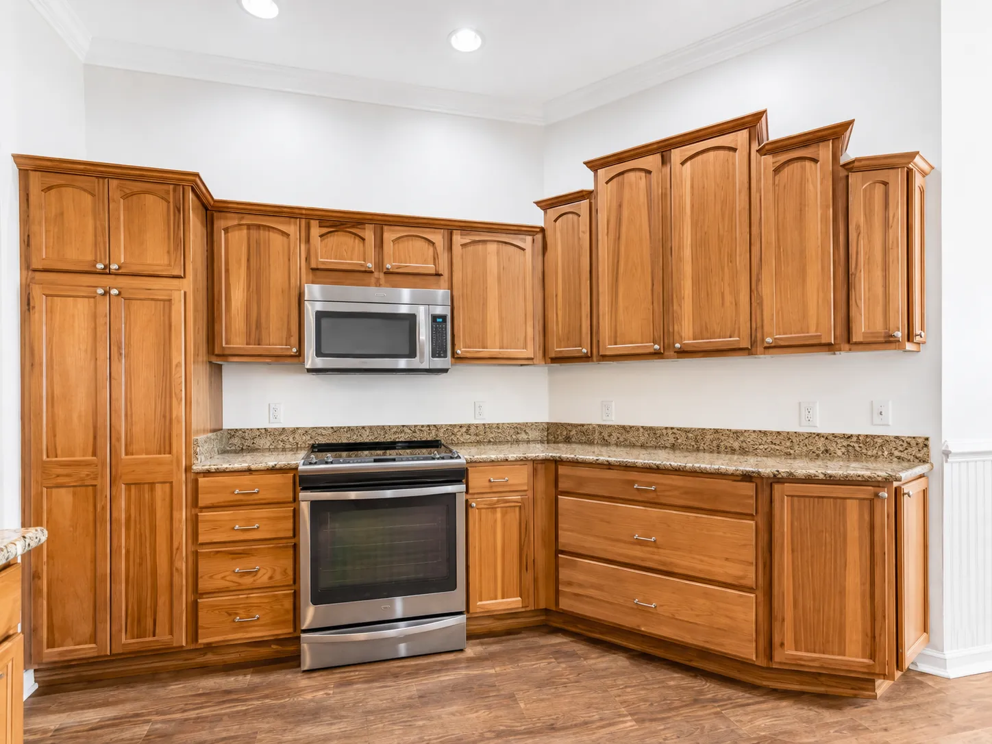 Kitchen cabinetry, granite countertops and stainless steel appliances