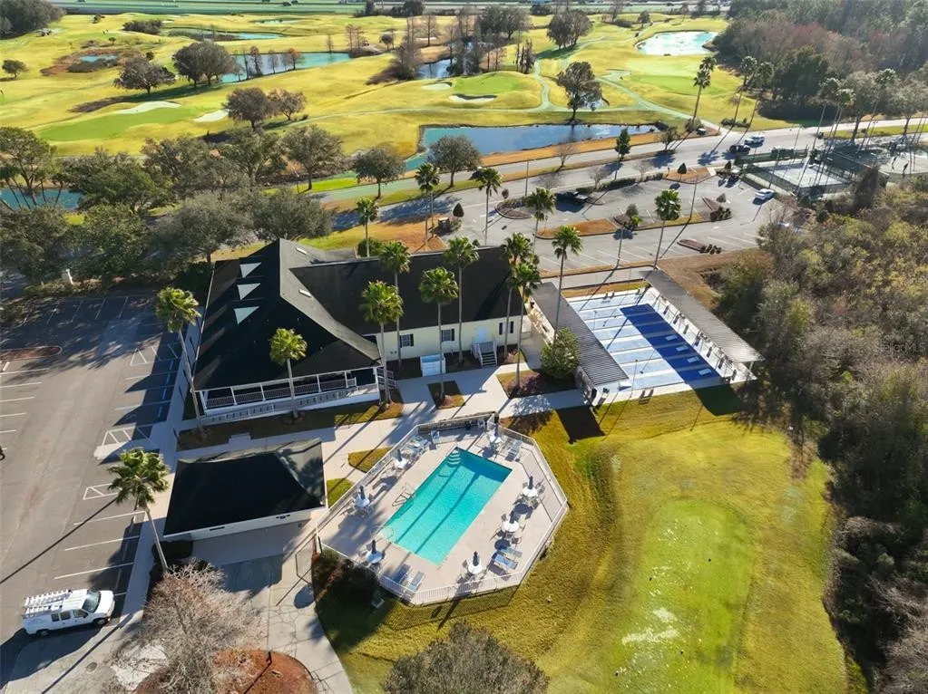 Aerial view of the Tampa Bay Golf and Country Club clubhouse, pool, and golf course